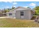 Newly renovated home with gray brick exterior and a covered porch at 815 N Hendry Ave, Fort Meade, FL 33841