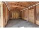 Unfinished garage with double doors and concrete floor at 815 N Hendry Ave, Fort Meade, FL 33841