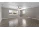 Large living room with tile floors and a window at 815 N Hendry Ave, Fort Meade, FL 33841