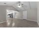 Open concept living room with vaulted ceiling, ceiling fan, and kitchen view at 815 N Hendry Ave, Fort Meade, FL 33841