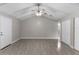 Main bedroom with vaulted ceiling, ceiling fan, and double door closet at 815 N Hendry Ave, Fort Meade, FL 33841