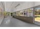 Screened porch with concrete floor and backyard access at 815 N Hendry Ave, Fort Meade, FL 33841