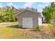 Detached shed with white barn doors at 815 N Hendry Ave, Fort Meade, FL 33841