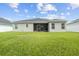 Large backyard with home view at 8218 Wilder Loop, Lakeland, FL 33809