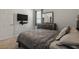 Cozy bedroom with wall-mounted TV and carpeted floor at 8218 Wilder Loop, Lakeland, FL 33809