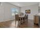 Dining room with hardwood floors and wall art at 8218 Wilder Loop, Lakeland, FL 33809