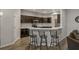 Kitchen with dark cabinets and a breakfast bar at 8218 Wilder Loop, Lakeland, FL 33809