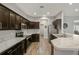 Spacious kitchen featuring dark wood cabinets and marble countertops at 8218 Wilder Loop, Lakeland, FL 33809