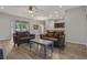 Living room with brown couches and coffee table at 8218 Wilder Loop, Lakeland, FL 33809
