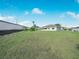 Large backyard with grassy area and privacy fence at 1007 Canary S Cir, Lakeland, FL 33809