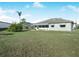 Spacious backyard with grassy area and trees at 1007 Canary S Cir, Lakeland, FL 33809