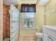 Bathroom with glass block shower and updated vanity at 1007 Canary S Cir, Lakeland, FL 33809