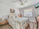 Cozy bedroom with full-size bed and wood flooring at 1007 Canary S Cir, Lakeland, FL 33809