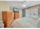 Bedroom with queen-size bed and wood flooring at 1007 Canary S Cir, Lakeland, FL 33809