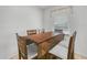Small dining area with a drop leaf table and four chairs at 1007 Canary S Cir, Lakeland, FL 33809