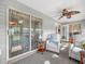 Relaxing Florida room with comfy seating and sliding glass doors at 1007 Canary S Cir, Lakeland, FL 33809