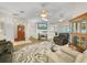 Bright living room with hardwood floors, comfortable seating, and a large TV at 1007 Canary S Cir, Lakeland, FL 33809