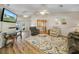Spacious living room with hardwood floors and ample natural light at 1007 Canary S Cir, Lakeland, FL 33809