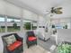 Relaxing sunroom with comfortable seating and plenty of natural light at 1007 Canary S Cir, Lakeland, FL 33809