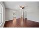 Bright main bedroom featuring hard wood floors, ceiling fan and ensuite bathroom at 103 Clydebank Pl, Kissimmee, FL 34758