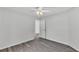 The airy bedroom is a clean slate, complete with gray floors and neutral paint at 105 3Rd Eloise St, Winter Haven, FL 33880