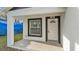 Inviting front porch view of a cozy home featuring a well-lit entrance and manicured lawn at 105 3Rd Eloise St, Winter Haven, FL 33880