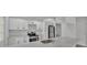Modern kitchen with white cabinets, quartz countertops, and stainless steel appliances at 105 3Rd Eloise St, Winter Haven, FL 33880