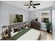 Serene bedroom featuring a ceiling fan, a warm color palette, and stylish modern furnishings at 1141 N Hampton Dr, Davenport, FL 33897