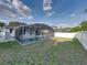 A screened-in pool area provides a relaxing outdoor space for homeowners at 1141 N Hampton Dr, Davenport, FL 33897