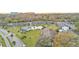 Aerial of condo community with pool and surrounding landscape at 1600 W Lake Parker Dr # B9, Lakeland, FL 33805