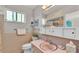 Bathroom with pink vanity, shower, and tiled walls at 1600 W Lake Parker Dr # B9, Lakeland, FL 33805