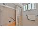 Bathroom with tub, shower, and tiled walls at 1600 W Lake Parker Dr # B9, Lakeland, FL 33805