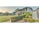 Building exterior showcasing landscaping and balconies at 1600 W Lake Parker Dr # B9, Lakeland, FL 33805