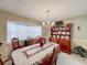 Dining room showcasing a wooden hutch and floral tablecloth at 1615 Caldwell St, Lakeland, FL 33803