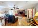 Spacious living room featuring hardwood floors, a ceiling fan, and ample natural light at 1615 Caldwell St, Lakeland, FL 33803