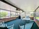 Relaxing screened porch with seating area and ceiling fans at 1615 Caldwell St, Lakeland, FL 33803