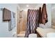 Bathroom featuring a shower stall with tiled walls, shower head and built-in shelves at 1640 Taylor Landing Dr, Bartow, FL 33830