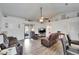 A bright living room features wood floors, a ceiling fan, and sliding glass doors to the outside at 1640 Taylor Landing Dr, Bartow, FL 33830