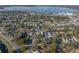 Aerial view of the property showcasing a desirable neighborhood, mature trees, and close proximity to a lake at 1841 Casco St, Lakeland, FL 33801