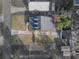 Aerial view of a home with well-maintained landscaping, a detached garage, and a spacious backyard at 1841 Casco St, Lakeland, FL 33801