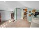 Attic room with a small storage area and hats hanging on the wall near a door at 1841 Casco St, Lakeland, FL 33801