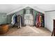 Attic space with racks of clothes, sloped ceilings, and natural light at 1841 Casco St, Lakeland, FL 33801