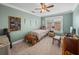 Bedroom features ceiling fan, window, and a pirate themed treasure chest at 1841 Casco St, Lakeland, FL 33801