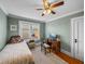 Inviting bedroom with a ceiling fan, desk, and comfortable furniture at 1841 Casco St, Lakeland, FL 33801