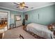 Comfortable bedroom featuring soft carpet, painted walls, and ceiling fan at 1841 Casco St, Lakeland, FL 33801