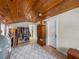 Bonus room showing wood ceiling, storage, and a view into another room at 1841 Casco St, Lakeland, FL 33801