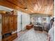 Bonus room featuring wooden ceilings, tile flooring, and ample storage at 1841 Casco St, Lakeland, FL 33801