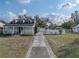 Charming home with a welcoming front porch, driveway, and well-maintained lawn at 1841 Casco St, Lakeland, FL 33801