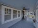 Inviting front porch with ceiling fans, white railings, and plenty of space for seating at 1841 Casco St, Lakeland, FL 33801