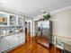 Bright kitchen features granite countertops, stainless steel refrigerator, and white cabinets at 1841 Casco St, Lakeland, FL 33801